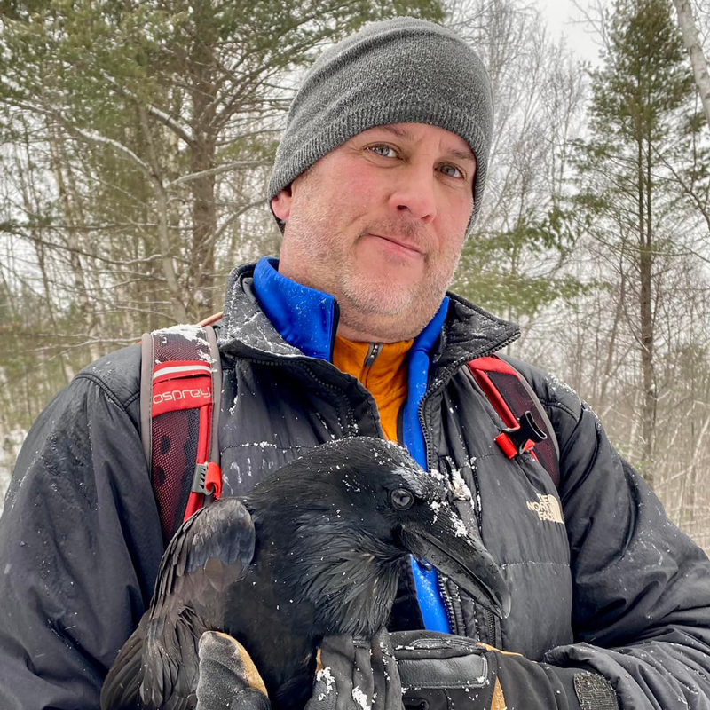 image of Bryon Black (executive director) holding a crow
