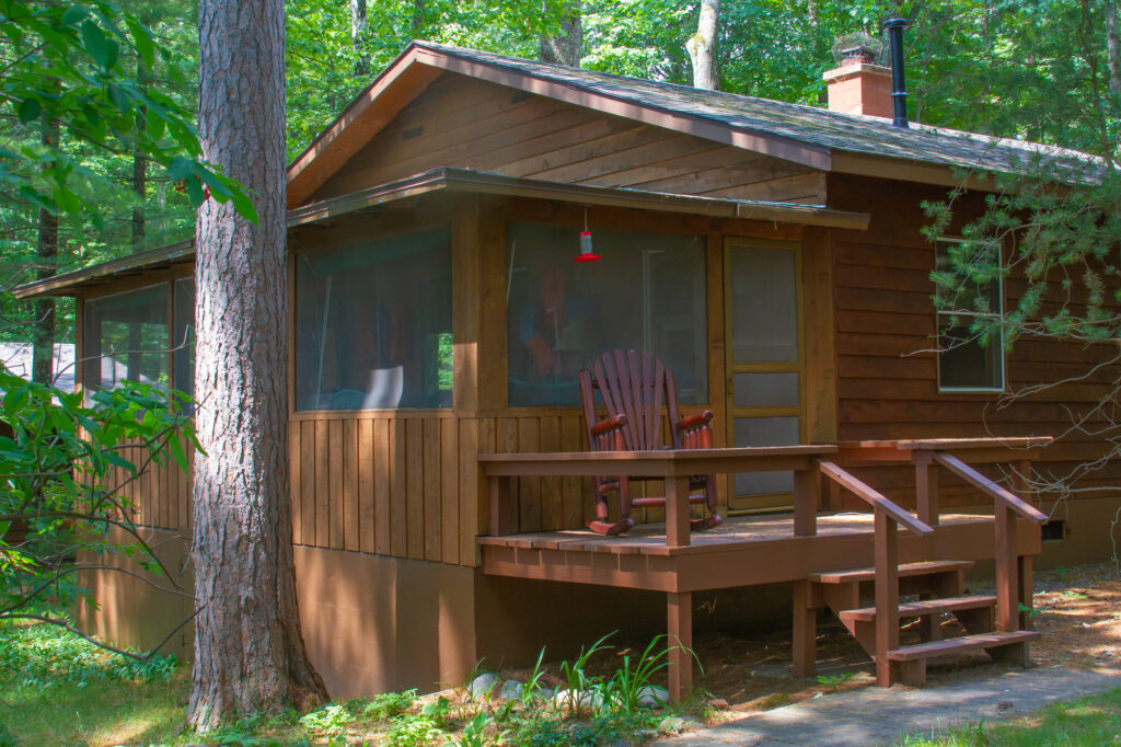 A lakeside cabin's screen porch